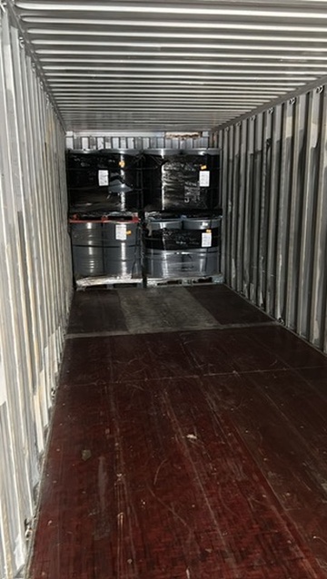 Container being loaded with consolidated battery and recyclable materials for international export shipment